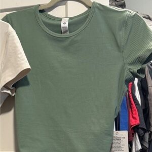 Lululemon Athletica Green Top and cream. The green is size 10 and cream is 12.